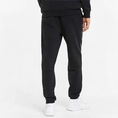 Puma fleece trousers with side band and cuff at the bottom ESS  Tape Sweatpants FL cl 849042 01 black